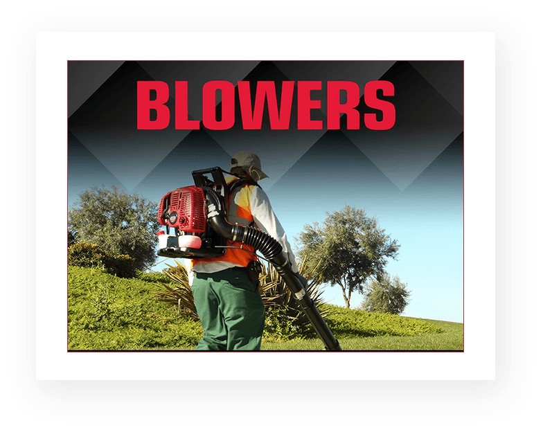 A man holding a leaf blower in his hand.